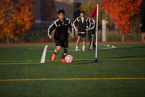 ACPHS student playing soccer.