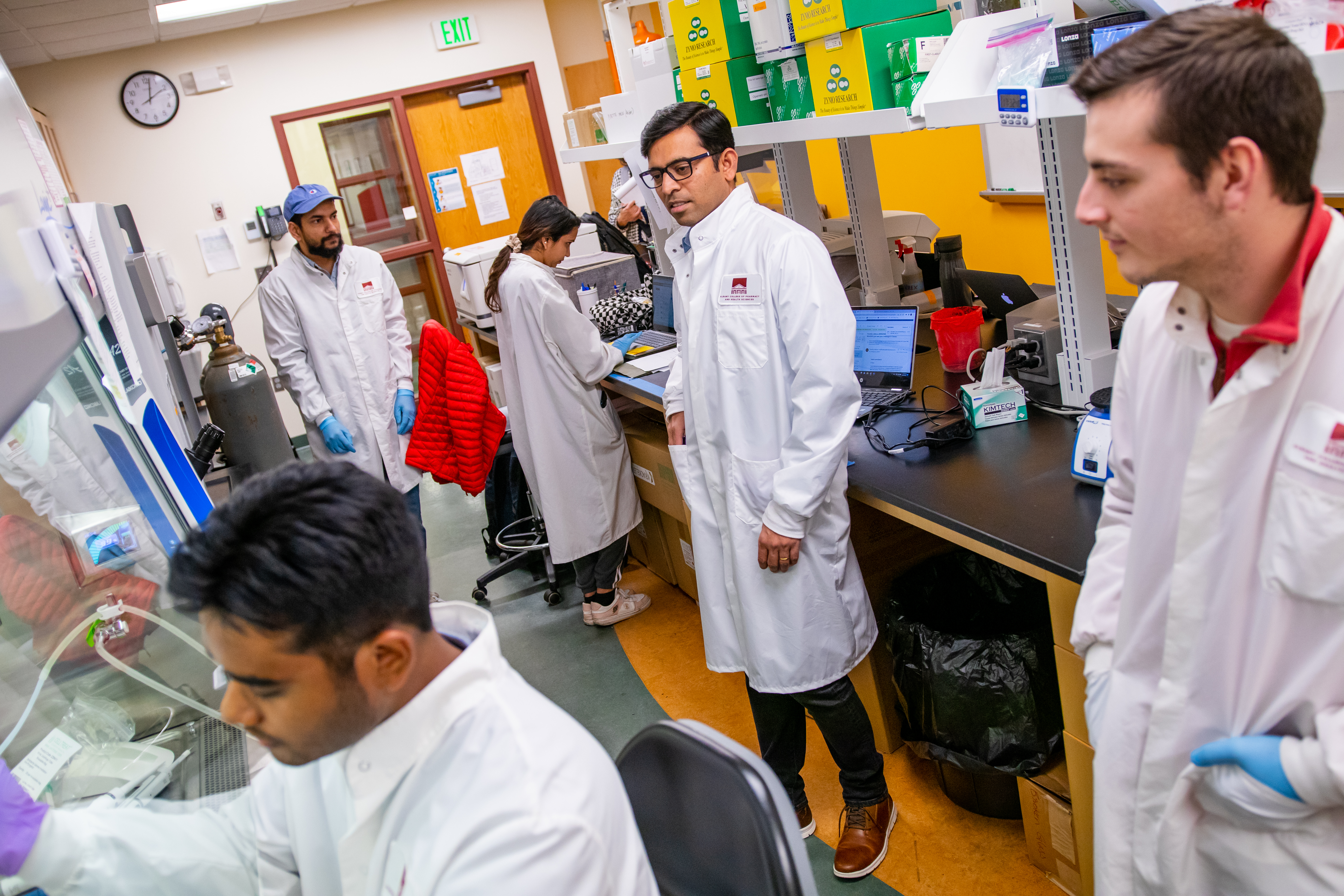 Researchers in the lab working on a cure for HIV: Pankaj Kanna Panneer Selvam, Dr. Imran Jamal, Anisha Paudel, Dr. Vir Singh and Landon Thompson.