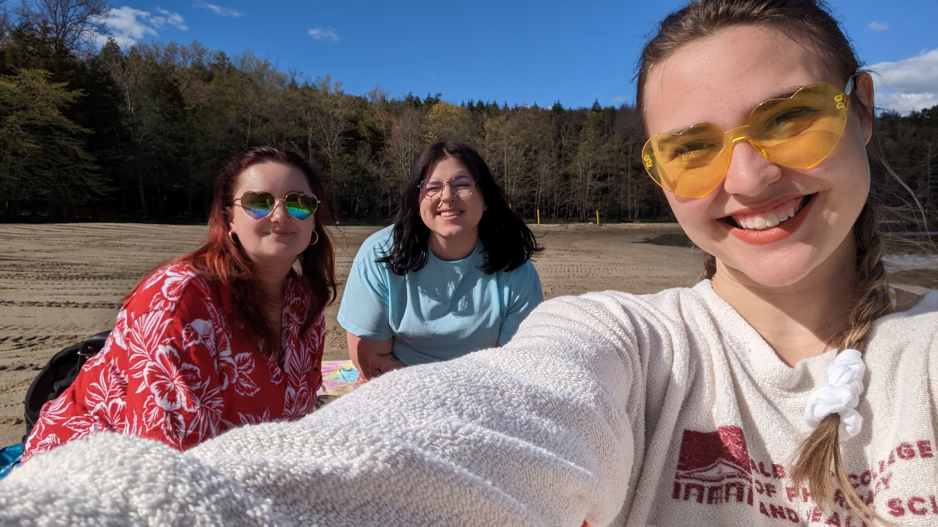 ACPHS students sit on beach of Grafton Lakes State Park