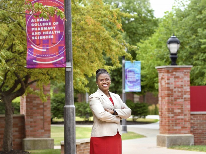 President Toyin Tofade stands on ACPHS Campus
