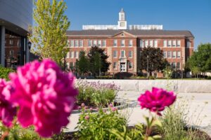 ACPHS Campus building with pink flowers