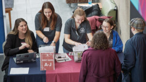 Admissions staff welcome students at Open House
