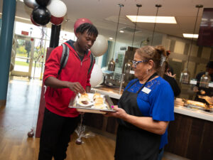 Dining Hall Manager gives student food