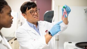 Dr. Kideok Jin holds samples