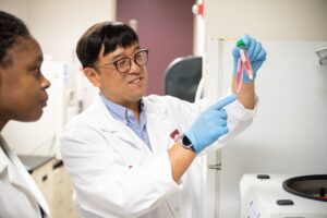 Dr. Kideok Jin holds samples