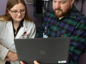 Dr. Zappone mentors a pharmacy student at a residency