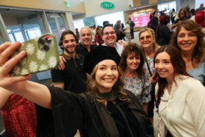 Families take a selfie at Commencement