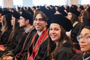 Graduates smiles at Commencement