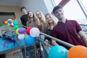 Medical Lab Science Club students stand on stairwell