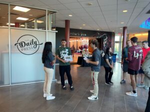 Open House attendees gather in Gozzo student center