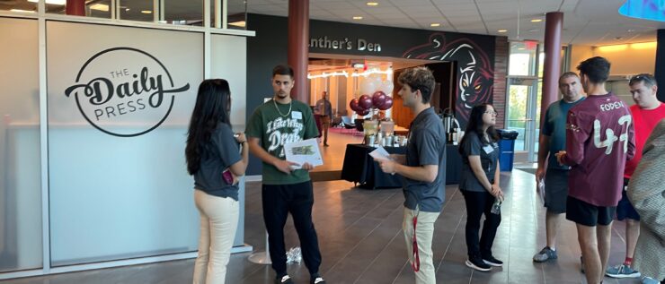 Open House attendees gather in Gozzo student center
