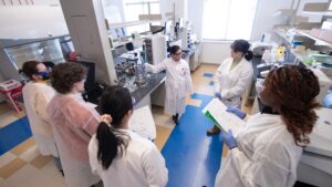 Students listen to instructor in MSBT. Biotechnology classroom