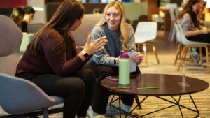 Students sit in common area of the Panthers Den