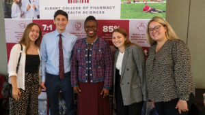 Students stand together with Toyin at Inauguration ceremony