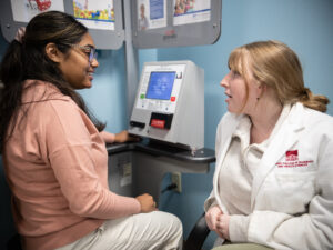 Two students discuss results from blood pressure at rotation