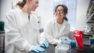 Valarie Carillo and student have a conversation in a lab