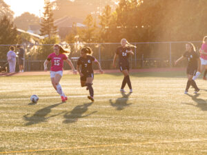 Womens Soccer team plays on field
