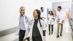 biomedical scientists walking down hall