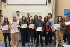 Honor students stand for group photo with awards