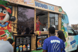 students lined up for shaved ice at a food truck 