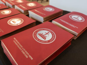 A stack of Commencement program on a table