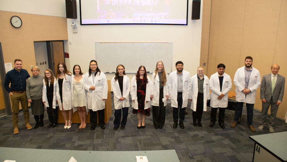 A group photo of the BS and MS CLS students after receiving their white coats