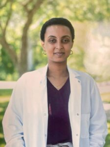 Headshot of Afomiya Kassie, grad dinner student speaker