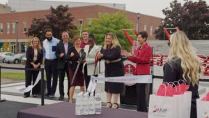 ACPHS President pain Tofade cuts the ribbon on the MVP Health Center on our campus with members of MVP Healthcare