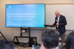 Man shares keynote re: Cancer research at the April 16 One Biosciences launch