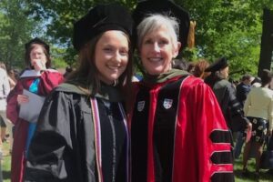 Alumni and former BOT member, Leigh Briscoe-Dwyer, stands alongside a female graduate at Commencement