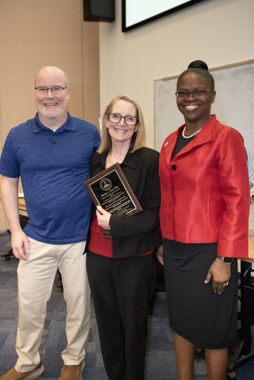 Richard Dearborn and President Tofade celebrates Martha Hass' 35 year anniversary
