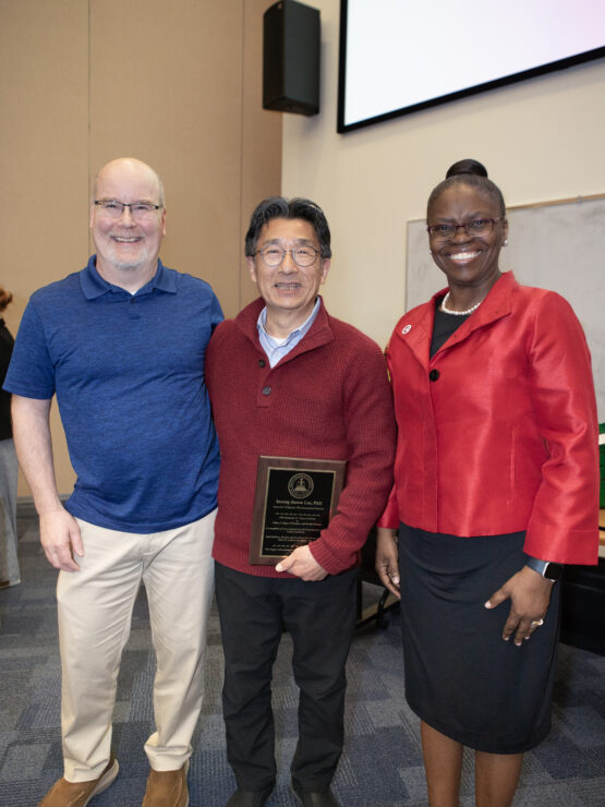 Richard Dearborn, Insong “James” Lee, and President Tofade celebrate James' retirement