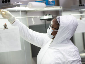 woman in biosafety gear in the lab